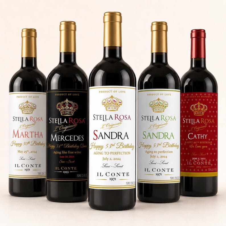 May include: Five wine bottles with custom labels featuring the Stella Rosa logo, a crown graphic, and personalized birthday text. The labels include names like Martha, Mercedes, Sandra, and Cathy, along with dates and the text Product of Love.