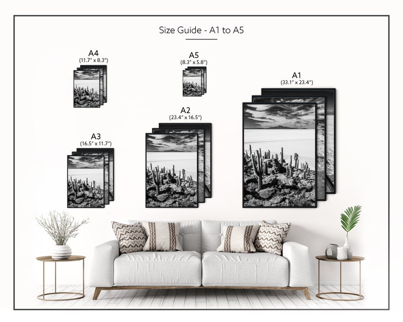 May include: Black and white framed art prints in various sizes, including A1 (33.1" x 23.4") to A5 (8.3" x 5.8"). The prints depict a landscape with cacti and a cloudy sky. The text "Size Guide - A1 to A5" is visible.