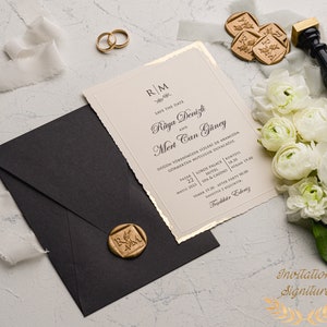 May include: A wedding invitation with gold accents and a wax seal. The invitation is for Raya Denizli and Mert Can G&uuml;ney. The wedding will take place on March 22, 2023 at the Lords Palace Hotel in Istanbul, Turkey.