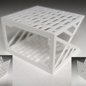 May include: White, geometric, open-frame storage organizer with a grid pattern. The organizer is made of plastic and has a modern design.