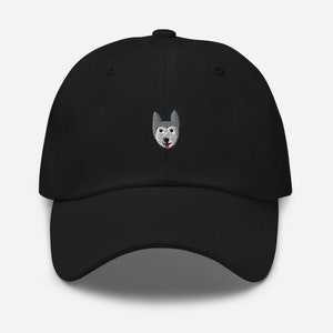 May include: A black baseball cap with an embroidered gray and white husky dog face on the front.