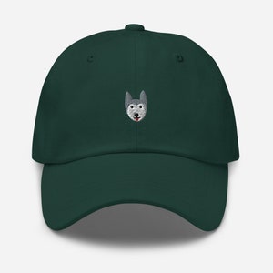 May include: A dark green baseball cap with an embroidered husky dog face on the front.