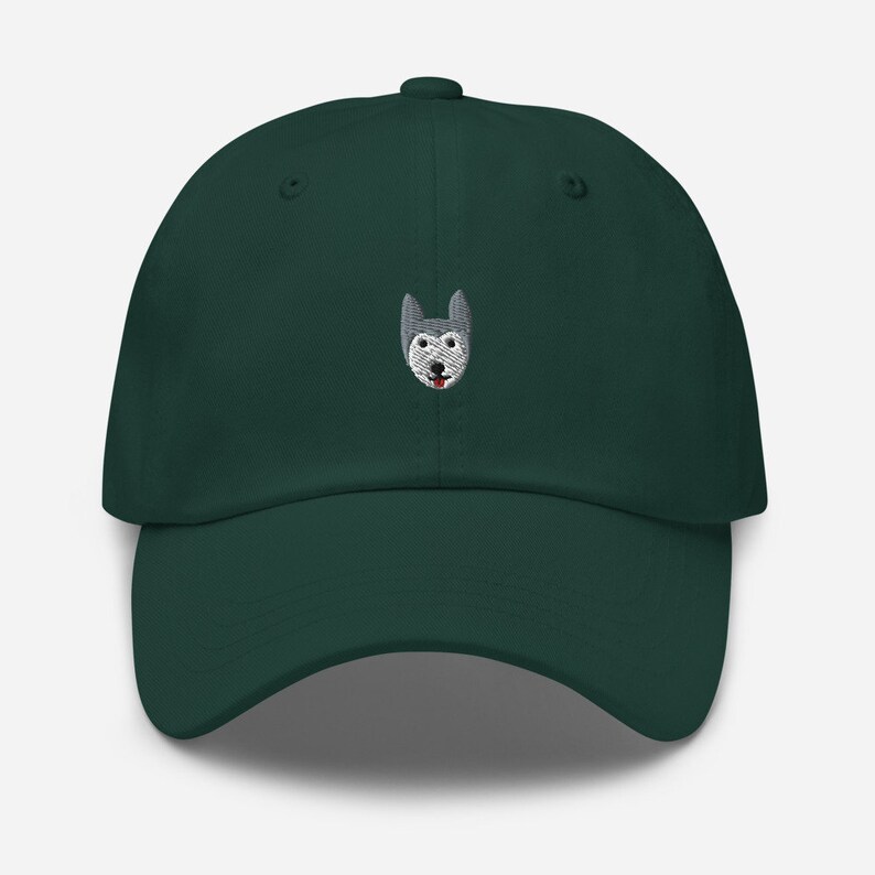 May include: A dark green baseball cap with an embroidered husky dog face on the front.