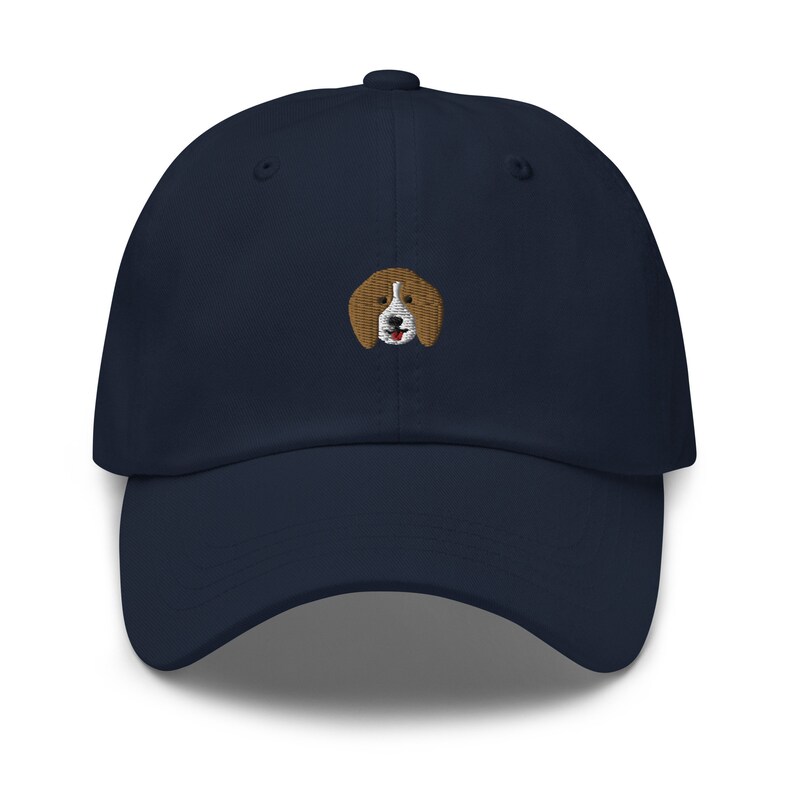 May include: A navy blue baseball cap with an embroidered beagle dog design.