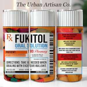 May include: A white and black striped tumbler with a red, yellow, and green pill bottle design. The bottle label reads "FUKITOL ORAL SOLUTION" and includes a patient name, pharmacy name, and directions for use. The text on the label reads "Take as needed when dealing with excessive bullshit."