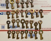 Grouping of 30 brass hollow barrel switch keys. Railroad style.