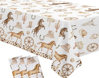 May include: White tablecloth with a brown and white western themed pattern. The pattern includes horses, cacti, wagon wheels, and horseshoes. The tablecloth has a brown and white spotted border. The tablecloth is accompanied by three matching napkins.