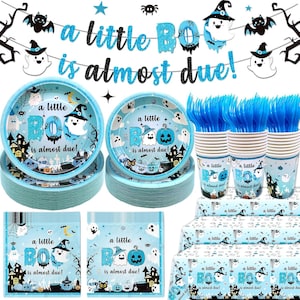 May include: A baby shower party set featuring a banner with the text a little BOO is almost due, stacks of light blue plates, cups, and napkins with ghost and pumpkin graphics, and blue plastic forks, all decorated with a Halloween theme.