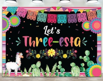 May include: A rectangular party backdrop featuring a black center with the text Let's Three-esta in colorful letters. The design includes a white llama, green cacti, floral accents, and a border of colorful paper banners and paper fans.
