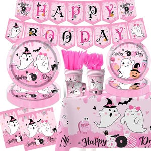 May include: Pink and white Halloween party supplies with a ghost theme. The set includes plates, cups, napkins, cutlery, a tablecloth, and a banner that says "Happy Boo Day".