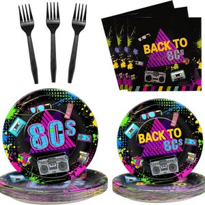 May include: A set of 80s themed party supplies, including black and neon green paper plates with a retro design, black and white napkins with the text "Back to the 80s", and black plastic forks.