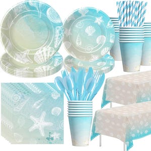 May include: A set of blue and white themed party supplies with a seashell design. The set includes plates, napkins, cups, cutlery, and a tablecloth.