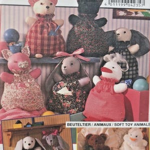 May include: A sewing pattern cover featuring various soft toy animals, including bears, bunnies, and a duck. The toys are made from fabric with floral and plaid patterns. The word "burda" is prominently displayed at the top.