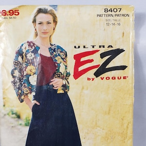 May include: A vintage Vogue Ultra EZ sewing pattern, size 12-16. The cover features a woman wearing a floral print jacket, a burgundy top, and wide-leg black pants. The pattern number is 8407.
