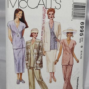 May include: McCall's sewing pattern featuring illustrations of women's suits and separates. The pattern includes a variety of styles, including a wrap top and skirt, a blazer and pants, and a double-breasted suit. The size is B (8,10,12).
