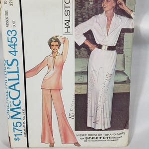 May include: Vintage McCall's 4453 sewing pattern envelope featuring a Halston design. The envelope shows illustrations of a dress and pants outfit. The bust size is 32 1/2 inches.