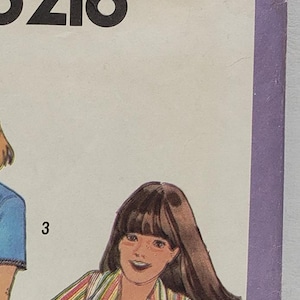 May include: Simplicity sewing pattern number 8218 for girls' tops. The pattern includes three different styles: a blue top with a V-neck, a pink top with a floral print, and a striped top with a V-neck. The pattern is for size 10.
