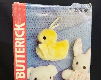 May include: A vintage craft pattern for making a teddy bear, a bunny, and a duck. The pattern is from the company Butterick and is number 200. The pattern is for a craft project and costs $2.65.