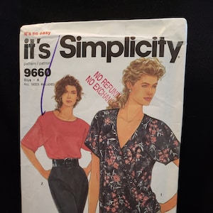 May include: Simplicity sewing pattern number 9660 for a blouse with a wrap style neckline. The pattern includes two views, one with a floral print and one with a solid color. The pattern is for sizes A, and all sizes are included.