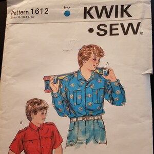 May include: Sewing pattern for boys' shirts, sizes 8-10-12-14. The pattern includes two designs: a blue shirt with a colourful print and a red shirt with a solid colour. The pattern is from Kwik Sew.