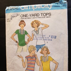 May include: A vintage sewing pattern for one-yard tops. The pattern includes three different styles of tops with short sleeves and a variety of necklines. The pattern is sized for stretch knits only. The pattern number is 7982 and the pattern is for size 16 miss.