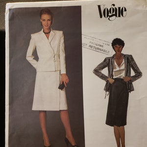 May include: Vogue pattern featuring two Valentino designs. One design is a cream-colored skirt suit with a wrap jacket. The other is a black and white checkered jacket with a black skirt. The pattern number is 2622.