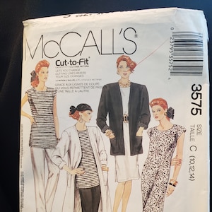May include: A vintage McCall's sewing pattern envelope featuring illustrations of women's clothing designs. The envelope has text in English and French, with the words "Easy Non-Stop Wardrobe" and "Petite-Able" visible. The pattern number is 3575.
