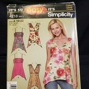 May include: A sewing pattern for a women's top with a V-neck and a high-low hemline. The pattern includes three different styles: a floral print, a paisley print, and a leopard print. The pattern is for sizes 10-22. The pattern is from Simplicity and is labeled "It's So Easy".