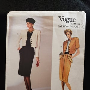 May include: Vogue Patterns American Designer sewing pattern for a skirt and jacket. The pattern is by Oscar de la Renta and the pattern number is 1751.
