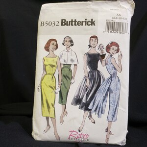 May include: Vintage sewing pattern for four different dresses. The pattern is from Butterick and is number B5032. The pattern is for sizes 6-8-10-12. The dresses are all different styles, including a sheath dress, a dress with a cape, a ball gown, and a dress with a wrap skirt.