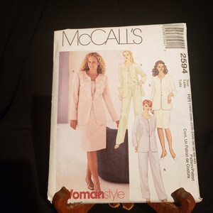 May include: A sewing pattern for a women's suit. The pattern includes a jacket, skirt, and trousers. The pattern is for sizes 18W-20W-22W-24W-36-38-40-42. The pattern is from McCall's and the pattern number is 2594.
