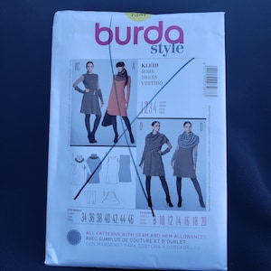 May include: Burda Style sewing pattern number 7287 for a dress with four different styles. The pattern includes sizes 34 to 46 and US sizes 8 to 20. The pattern is printed on white paper with black and gray illustrations of the dress styles.