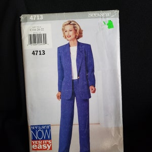 May include: A sewing pattern for a blue blazer and trousers suit. The pattern is from see & sew and is for sizes 18-20-22. The pattern number is 4713.