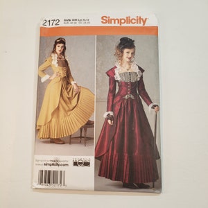May include: Simplicity sewing pattern number 2172 for sizes 6, 8, 10, and 12. The pattern includes instructions for making two steampunk-inspired dresses. One dress is a burgundy color with a black and white striped bodice and a black lace collar. The other dress is a mustard yellow color with a brown bodice and a white lace collar. Both dresses feature a bustle in the back and a long skirt.