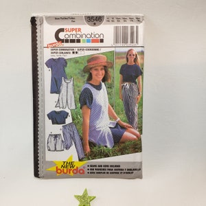 May include: A sewing pattern for a dress and trousers. The pattern is from Burda and is for sizes 11-18. The pattern includes instructions for sewing seams and hems. The pattern is for a blue and white polka dot dress and striped trousers.
