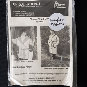 May include: A vintage sewing pattern for a classic wrap coat. The pattern is titled "Classic Wrap Coat" and is style #215. The pattern is from Emmalou's Heirlooms and is a multi-sized pattern for adults.