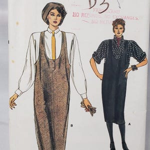 May include: Vintage Very Easy Very Vogue pattern 9128, sizes 12-16. The cover shows illustrations of two women in dresses. One wears a beret, white shirt, and brown jumper. The other wears a black dress with polka dots.