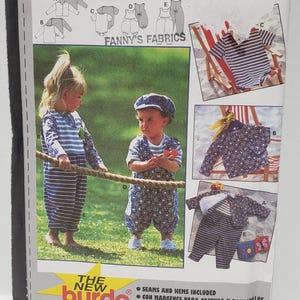 May include: A sewing pattern for children's clothing from Burda. The pattern includes instructions for making a variety of garments, including dungarees, shirts, and jackets. The pattern is for sizes 6 months to 3 years.