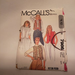 May include: A vintage McCall's sewing pattern envelope with illustrations of vests. The envelope includes the text "McCall's" and "7986". The pattern is for a Misses size 10, with a bust size of 82.5 cm.