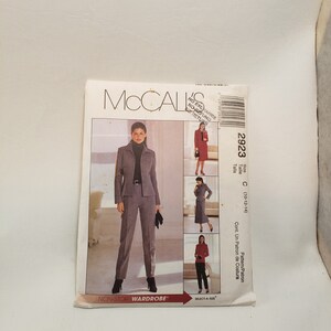 May include: A sewing pattern for a women's suit. The pattern is for sizes 10-12-14. The pattern is from McCall's and the pattern number is 2923. The pattern is for a jacket and trousers.