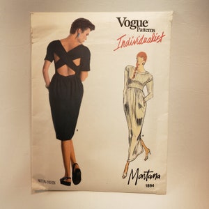 May include: Vogue Patterns Individualist sewing pattern for a dress with a criss-cross back detail. The pattern is by Montana and the number is 1894.