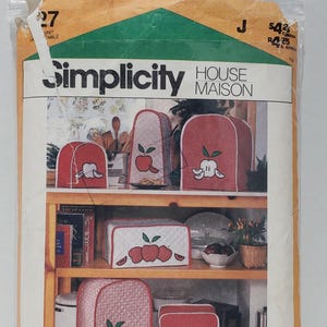 May include: A Simplicity package of appliance covers with apple designs in red and white. The package includes 10 covers and the text "Simplicity HOUSE MAISON". Blue wax transfers are included.