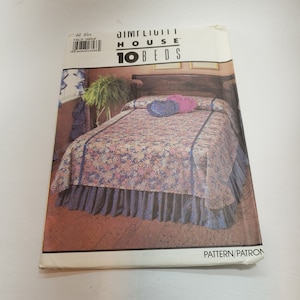May include: A sewing pattern for a bed skirt with a floral print and a ruffled edge. The pattern is from Jim-Flici House 10 Beds.