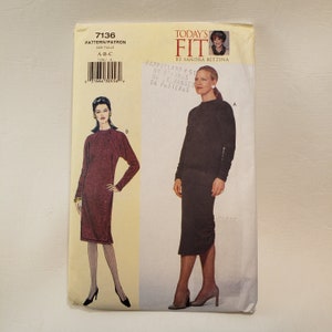 May include: A sewing pattern for two dresses. The pattern is for sizes A, B, and C. The pattern is from Today's Fit by Sandra Betzina. The pattern includes instructions for making a burgundy dress with long sleeves and a black dress with long sleeves.