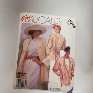May include: A sewing pattern for jackets, McCall's pattern number 2914, size 8. The pattern features two women wearing jackets, one in a cream color and the other in a pink color. The text "Learn to Sew for Fun" is printed on the pattern.