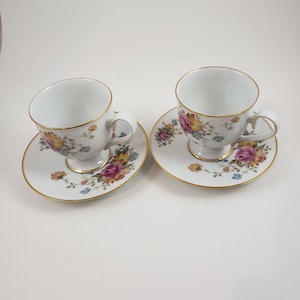 Lot of 2 Noritake Ireland Scala 2761 cup and saucer, fine floral china has pinks, golds and blues and a lovely gold rim