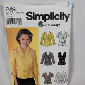 May include: A Simplicity 7082 sewing pattern envelope for a wrap-style jacket with a shawl collar and tie waist. The front shows a yellow jacket, while the back displays six variations including solid, polka dot, plaid, and floral print designs.