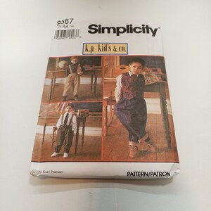 May include: Simplicity sewing pattern for boys' clothing, featuring three different outfits with vests, shirts, and pants. The pattern is labeled "k.p. kid's & co." and includes instructions for making the garments.