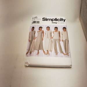May include: Simplicity sewing pattern number 5245, easy-to-sew, for sizes K, 8, 10, 12, 14. The pattern shows five different outfits, including a dress, trousers, and a jacket.