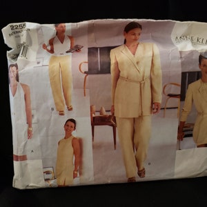 May include: A sewing pattern for a suit with a jacket and trousers. The pattern is for size 22.5 and is by Anne Klein.